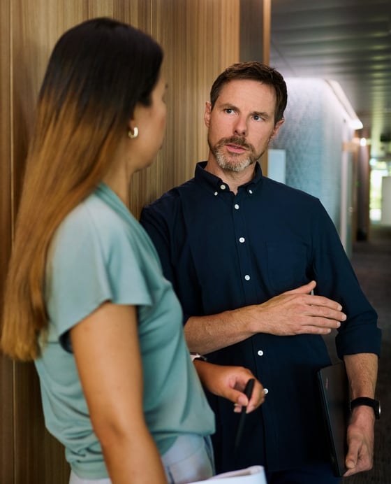 two people talking in the office