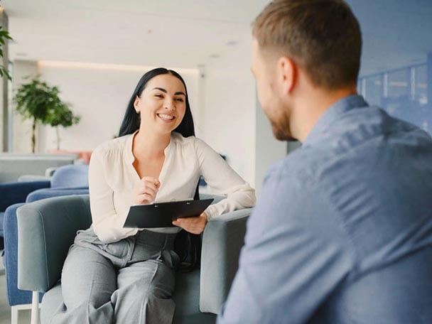 two-colleagues-talking_608x456