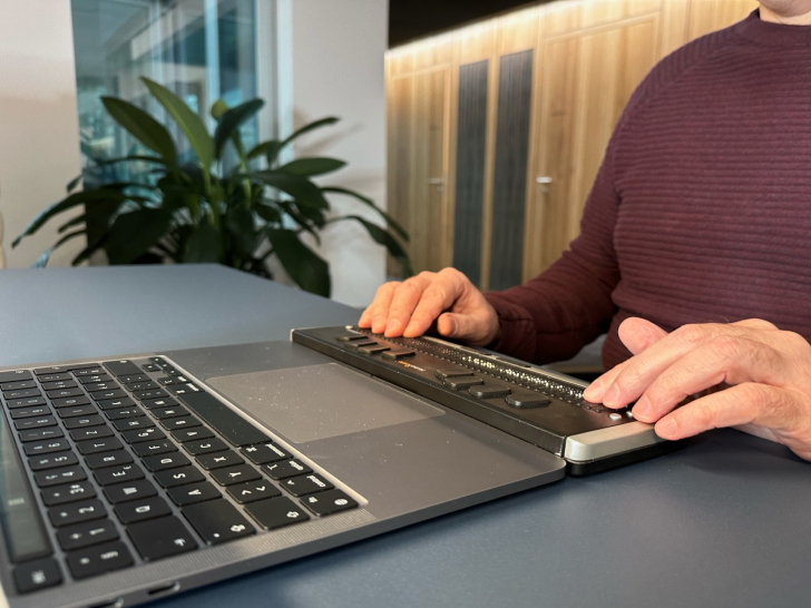man using an accessibility keyboard