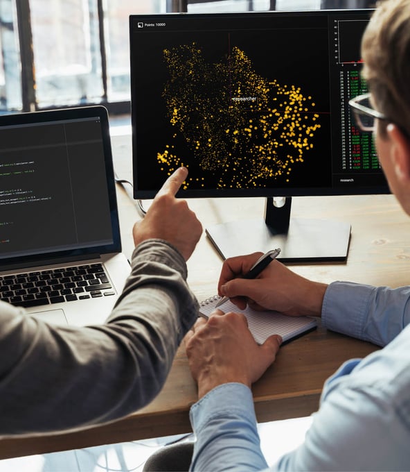 Man pointing on monitor 