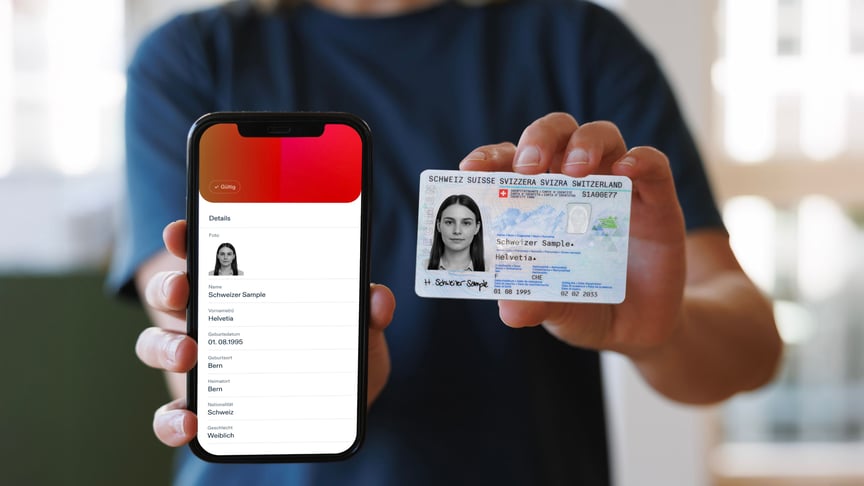 A man holding a smartphone with an ID app and an ID card into the camera