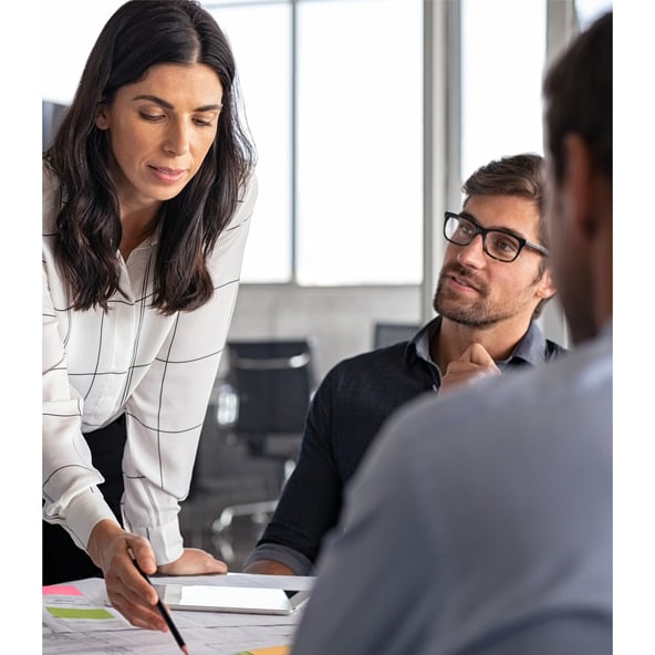 Female work colleague shows something to male work colleague