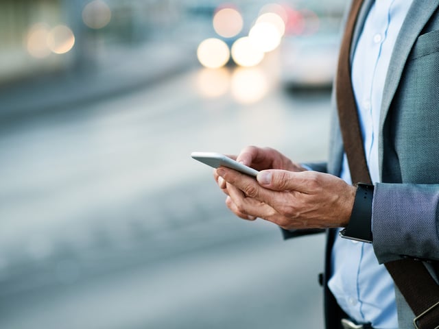 Person typing on smartphone 