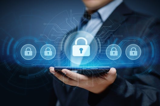 Man in business suit holding phone in hand with screen showing  transparent locks symbolizing security 