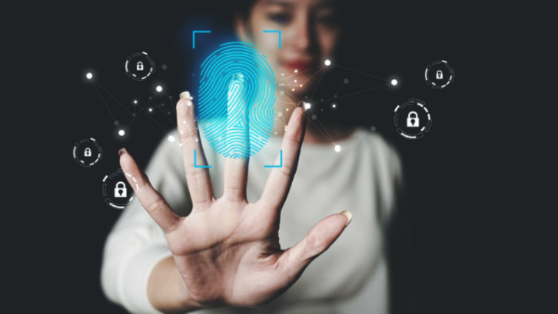 Woman holding her hand on invisible display which shows locks symbolizing security 