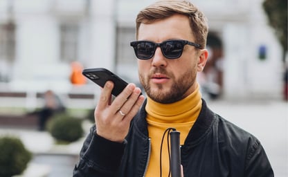 visually impaired man using mobile phone