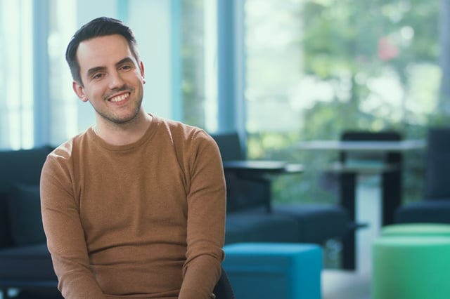 happy employee sitting in the work lounge