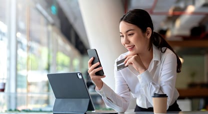 a woman is using a phone for online transaction
