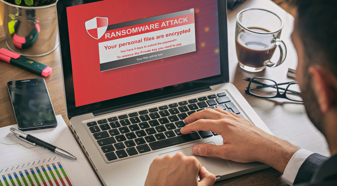 Laptop screen displaying ransomware attack message 