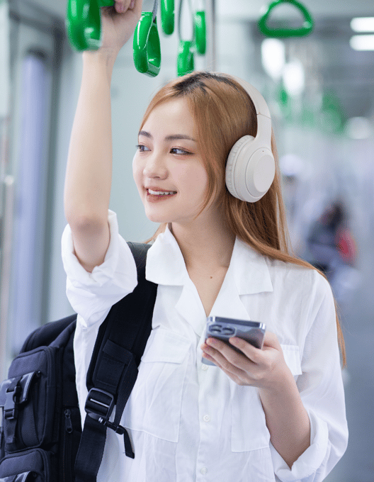 a young person using a phone in metro