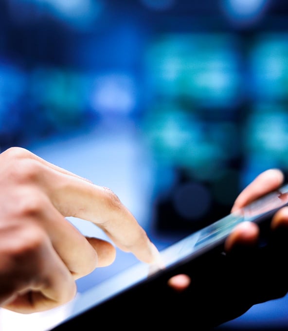 hand holding tablet device