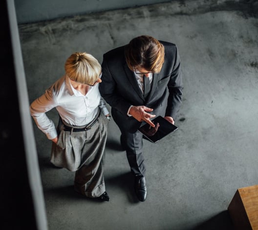 Female and male working colleagues walking seen from bird’s eye perspective 