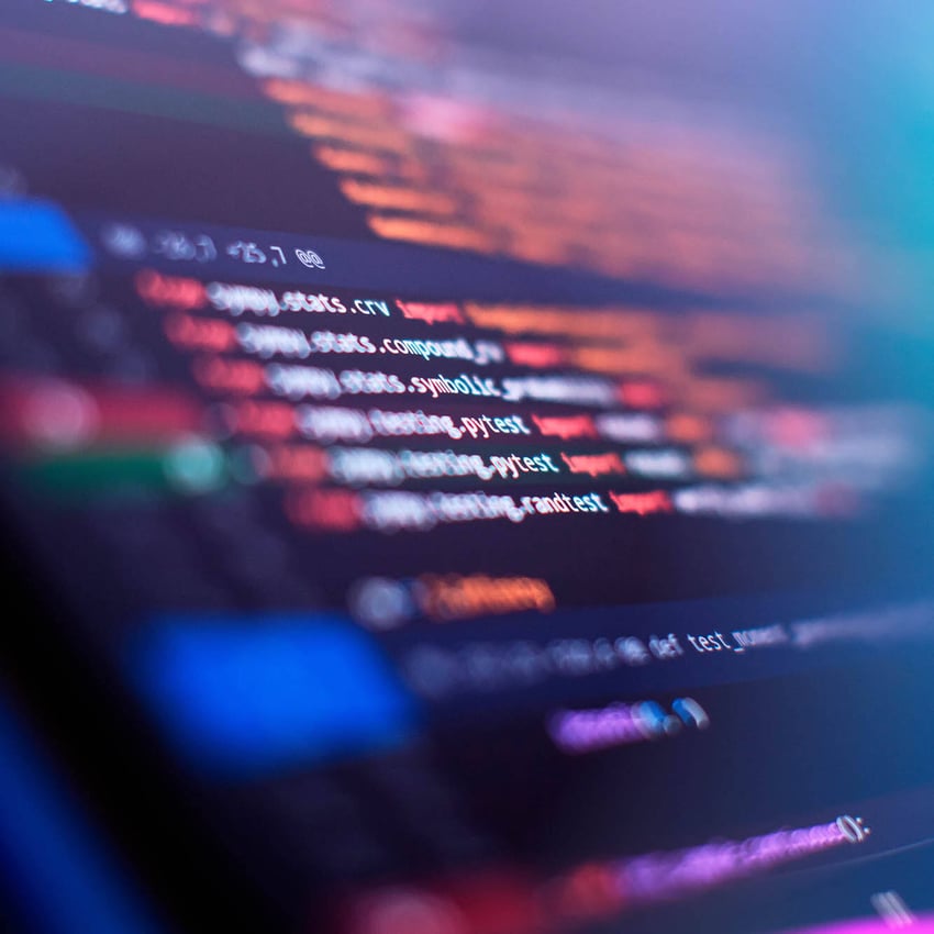 Close-up of blurred computer code on a screen