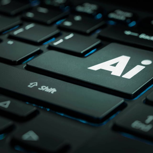 Close-up of a keyboard with an “AI” key.