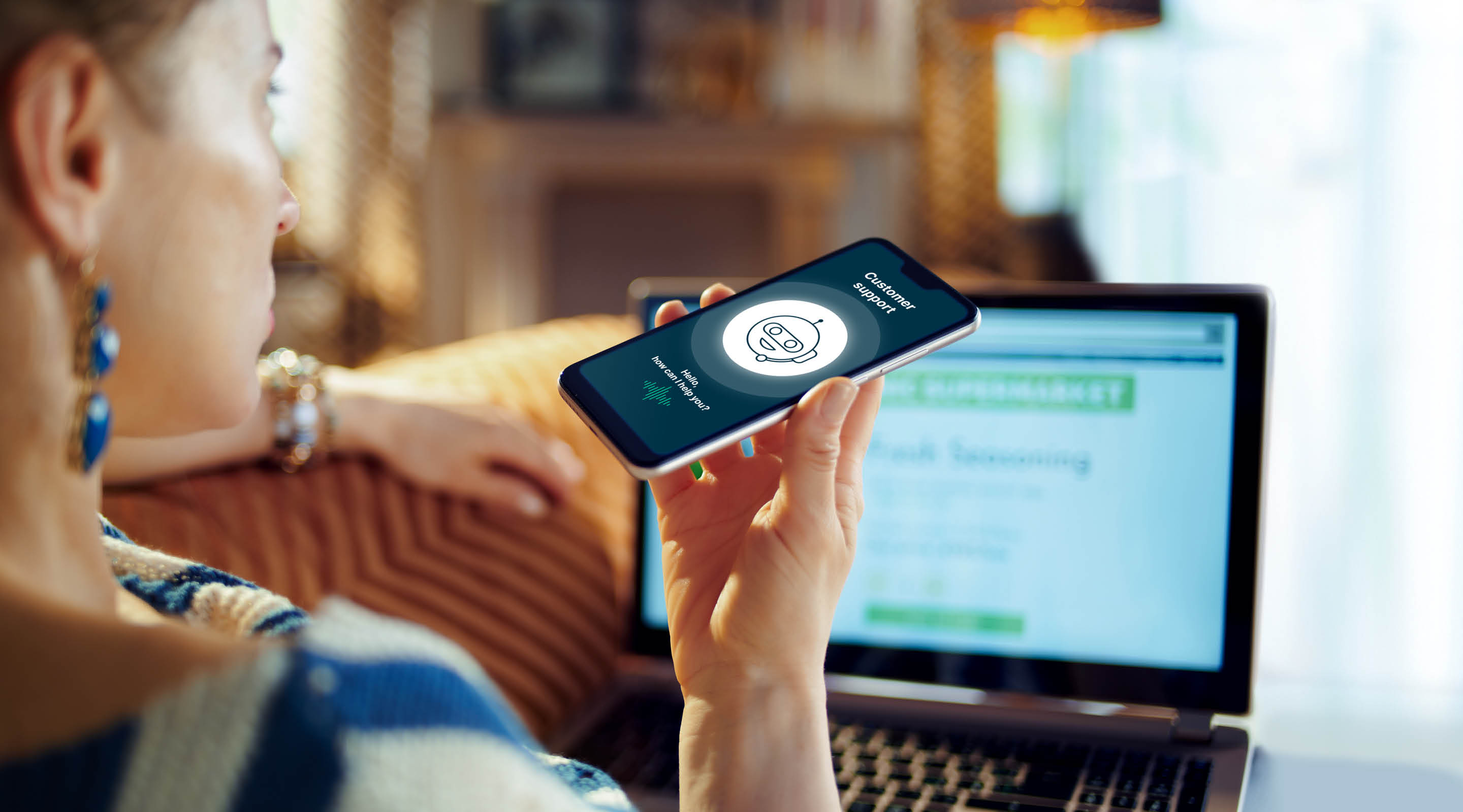 Woman talking with a customer service voicebot through her smartphone